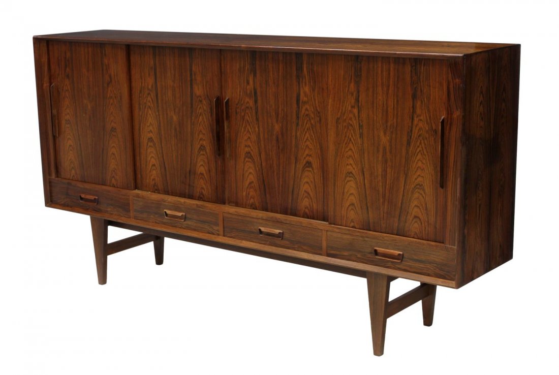 DANISH MID-CENTURY MODERN ROSEWOOD SIDEBOARD: Danish mid-century modern rosewood sideboard, four sliding doors opening to a divided interior with six adjustable shelves total and mirrored bar, fitted with a small shelf and a vertical wood plate s