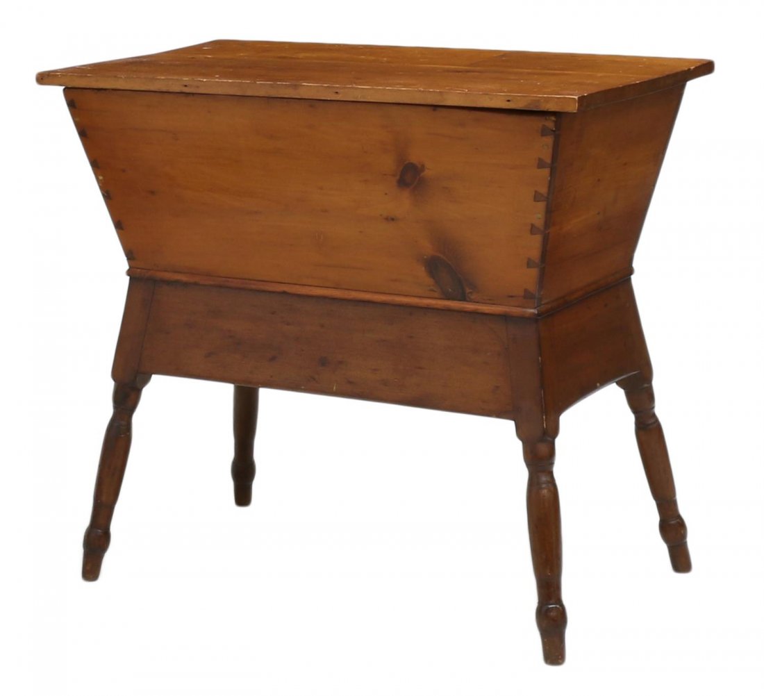 ANTIQUE AMERICAN PINE DOUGH BOX: American pine dough box, 19th c., the rectangular lid lifts to reveal the dough bin, all rising on angular turned legs, joinery includes dovetail and square nails, 30.5"h, 34"w, 19"d Start Price: $100