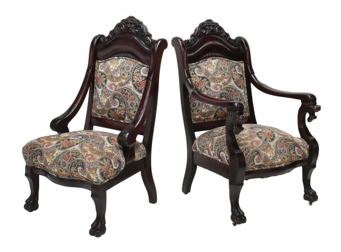(2) AMERICAN MAHOGANY LIONS CHAIRS, 19TH C.: (lot of 2) American mahogany highback parlor chairs, 19th c., each with a central lion faced crest rail, later tapestry like foliate seat and back fabric, rising on paw feet: (1) chair with arms havin
