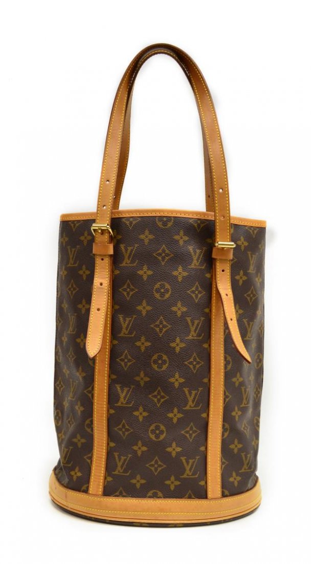 LOUIS VUITTON MONOGRAM CANVAS BUCKET BAG: Louis Vuitton "Bucket" bag in monogram canvas with leather trim, one open cell and side zipper pocket, some discoloration to leather on base, bag; approx 14"h, 10.75"w, 1.25lbs Start Price: $300.00