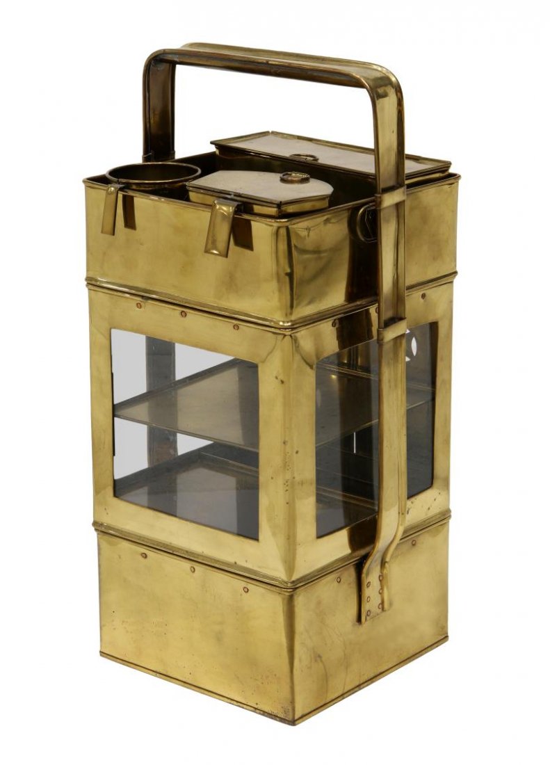 VIETNAMESE BRASS HANDLED NOODLE CADDY: Vietnamese brass noodle caddy, square in form, including two lidded and one open top side hanging condiment containers, removable top tier tray, latched double doors opening to a single shelf over a h