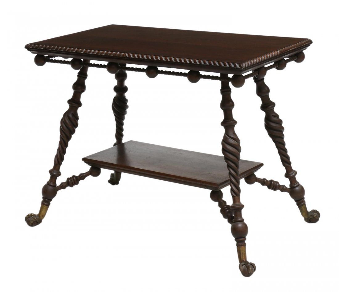 MAHOGANY TWIST & SPINDLE CLAW FOOT PARLOR TABLE: Mahogany parlor table, late 19th c., a rectangular roped edge top over the ball and twist spindle decorated apron, a lower shelf joins the angled turned and twist legs, rising on brass supports with b