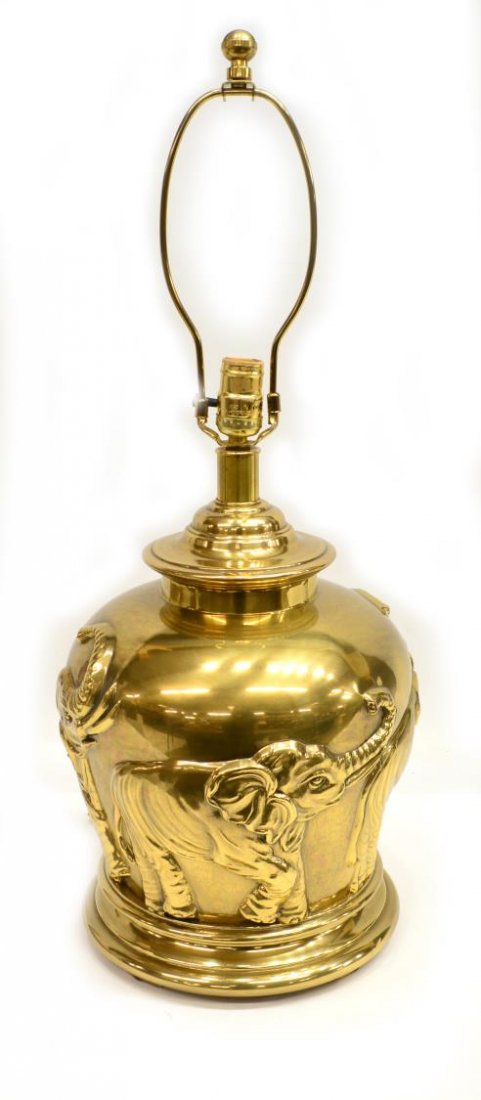 FREDERICK COOPER ASIAN STYLE BRASS TABLE LAMP: American brass Asian style one light table lamp, design by Frederick Cooper, vasiform body having large relief elephants, retaining designer tag, approx 27.5"h, 13.75lbs Start Price: $50.00
