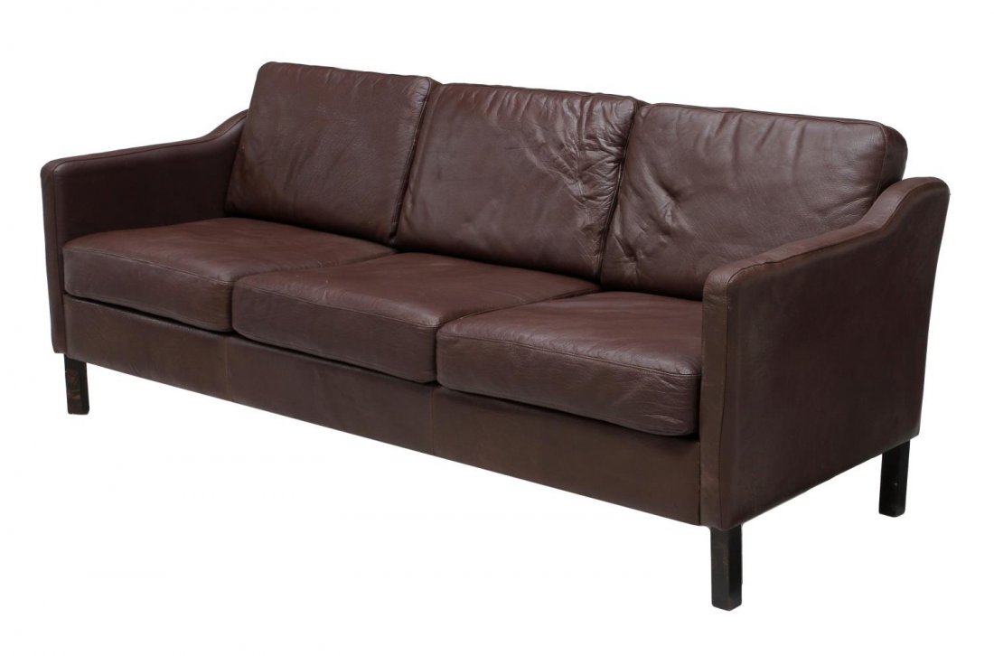 DANISH MID-CENTURY MODERN LEATHER SOFA: Danish mid-century modern sofa in burgundy-brown leather, upholstered frame around the three seat sofa, removable back and seat cushions, rising on square legs, approx 32"h, 75"w, 28"d Start Price: $4
