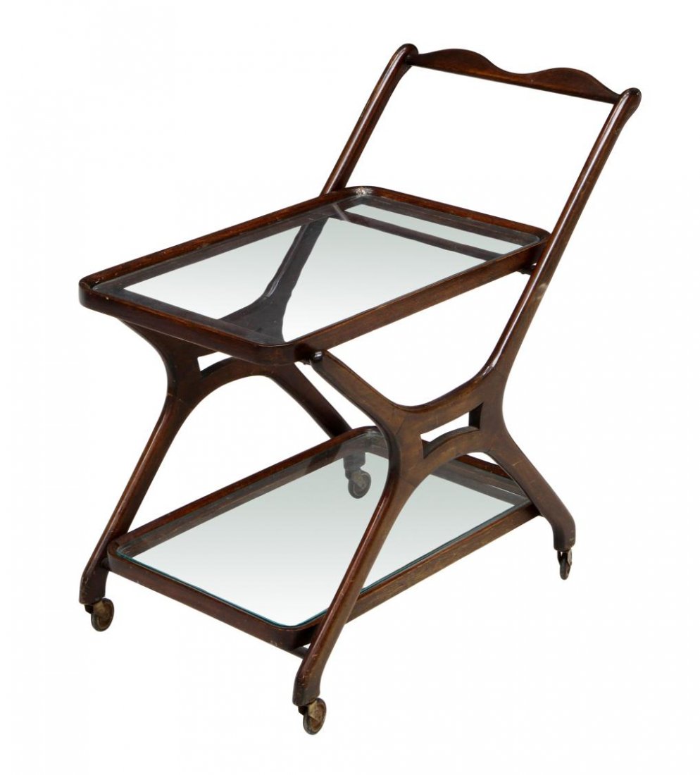 ITALIAN MID-CENTURY MODERN SERVICE CART: Italian mid-century modern service cart, c. 1960, the walnut finish frame with two glass tiers rising on castors, 29.25"h 17"w, 29"d Start Price: $150.00