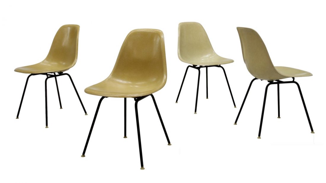 (4) CHARLES EAMES FOR HERMAN MILLER SHELL CHAIRS: (lot of 4) Moulded plastic shell stacking chairs, design by Charles Eames for Herman Miller, rising on angular black steel legs, Herman Miller tags at underside, 31.5"h, 18.5"w, 21"d Start Price: $100