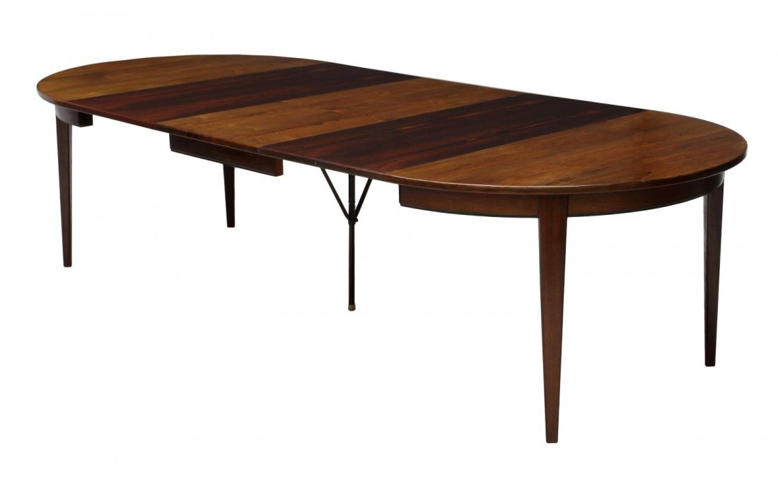 DANISH MID-CENTURY MODERN ROSEWOOD DINING TABLE: Danish mid-century modern rosewood dining table, by Gunni Omann for Omann Jun Mobelfabrik, model 299-KK967, round top on square tapering supports, accompanied by three 19.5"w leaves, without leaves: a