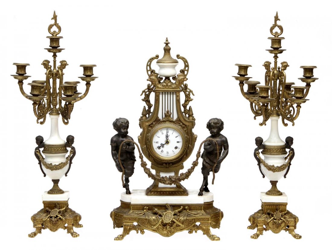 (3) ITALIAN BRASS & MARBLE GARNITURE CLOCK SET: (set of 3) Italian brass and marble garniture clock set, sculptured satyrs flank the Louis XV style clock with rocaille embellishments, the clock face with Roman numerals on porcelain and retailers na