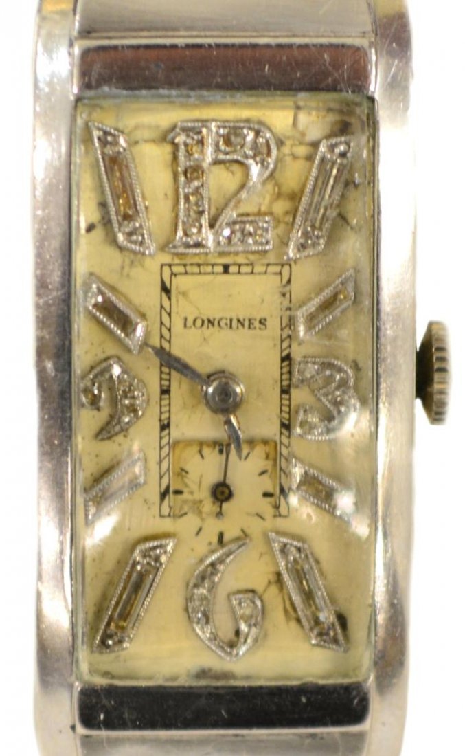 LONGINES ART DECO PLATINUM DIAMOND WRISTWATCH: Longines Art Deco platinum and diamond wrist watch, c. 1935, elongated rectangular curvex case with silver tone dial and diamond markers, marked 10% Irid Plat to back, added two tone silver and gold R