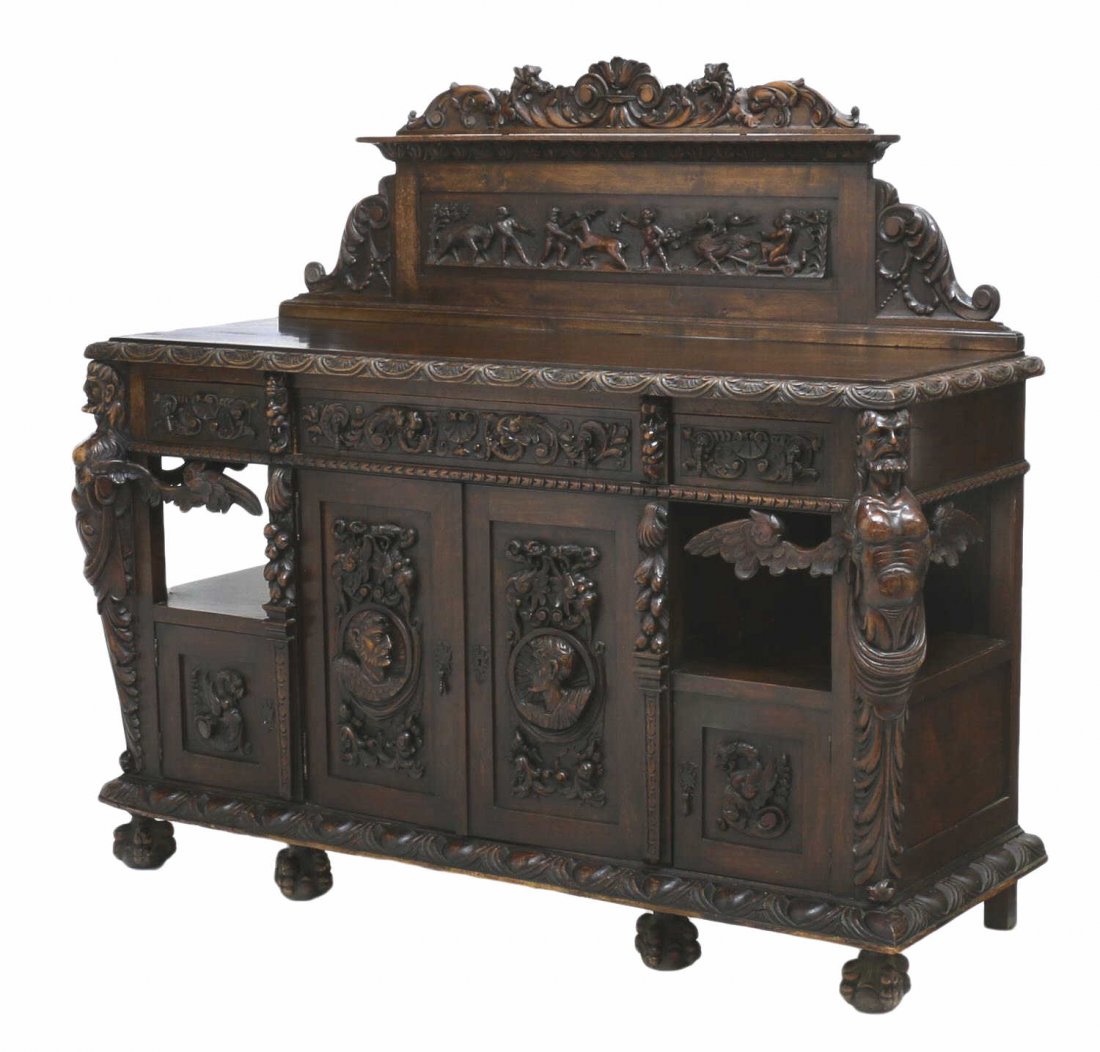 HIGHLY CARVED SPAIN RENAISSANCE REVIVAL SERVER: Renaissance Revival highly carved sideboard, Northern Spain, the carved backsplash featuring flora, fauna and putti, the case fitted with three frieze drawers over two central cabinet doors opening to