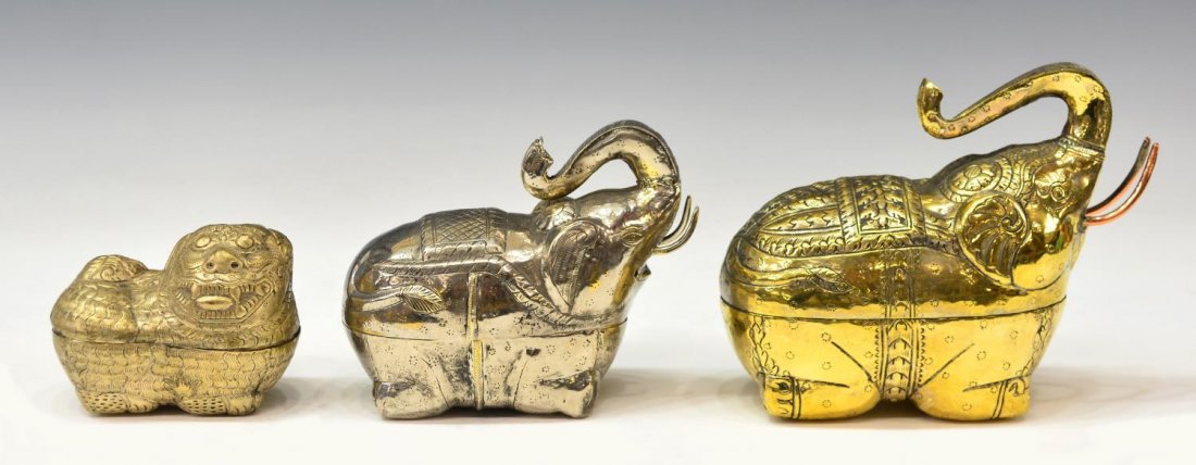 (3) FIGURAL METAL BETEL NUT BOXES, ELEPHANT & LION: (lot of 3) Figural metal betel nut boxes with traditional repousse decoration, including: (1) gold tone elephant, approx 6"h, 7.25"w; (1) silver tone elephant, approx 5.25"h, 6"w; (1) copper tone lion
