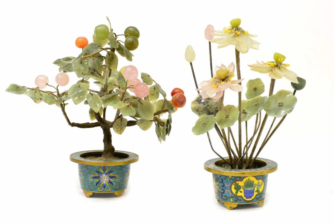 `(2) CHINESE HARDSTONE TREES IN CLOISONNE POTS: (lot of 2) Chinese hardstone trees in cloisonne enamel and brass pots, including: (1) with fruiting branches of carnelian, jade and rose quartz grapes, pot having lotus scrolls; approx 9"h; (1) with f