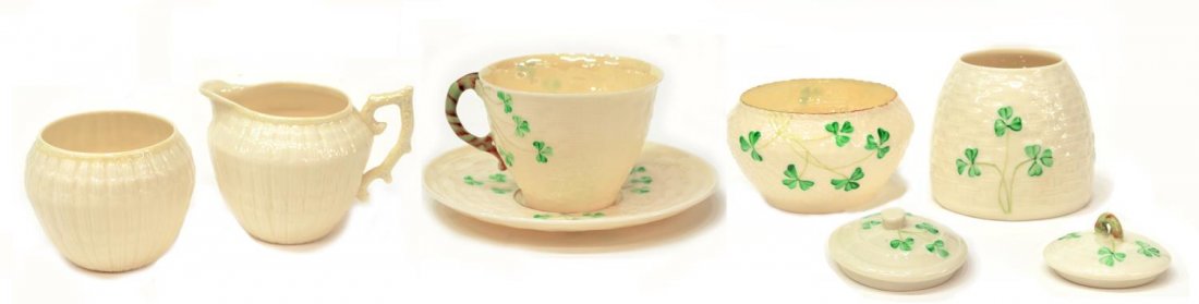 (7) IRISH BELLEEK LIMPET & SHAMROCK TABLEWARE: (lot of 7) Irish Belleek tableware: (2pc) "Limpet" pattern open sugar and creamer with handle, 3.5"h; (5 pcs) "Shamrock" pattern, including a cup with saucer, 5.5"diam, a lidded condiment jar, 3.5"h, 