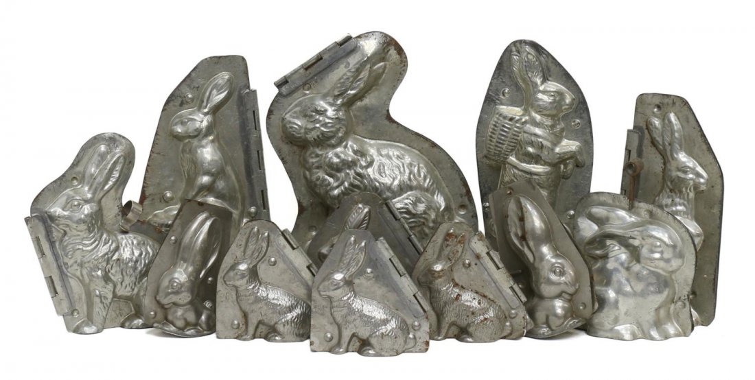 (12) COLLECTION ANTIQUE BUNNY CHOCOLATE MOLDS: (lot of 12) Antique / vintage rabbit chocolate molds, some German, comprising: (1) upright bunny wearing basket backpack, marked Rhenania Reiner Fischer Koln, 4630, 8.5"h; (1) bunny with basket and eg