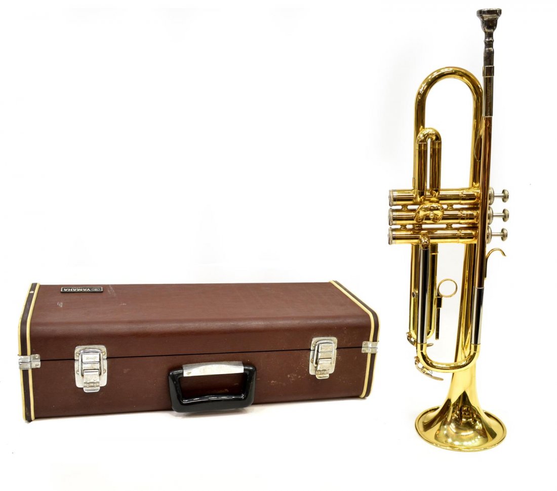 VINTAGE YAMAHA YELLOW BRASS TRUMPET IN CASE: Yamaha yellow brass trumpet, c. 1984-1997, model YTR-2320, retaining owner's manual and case, approx 6"h, 19"w, 5"d, 6.5lbs Start Price: $100.00