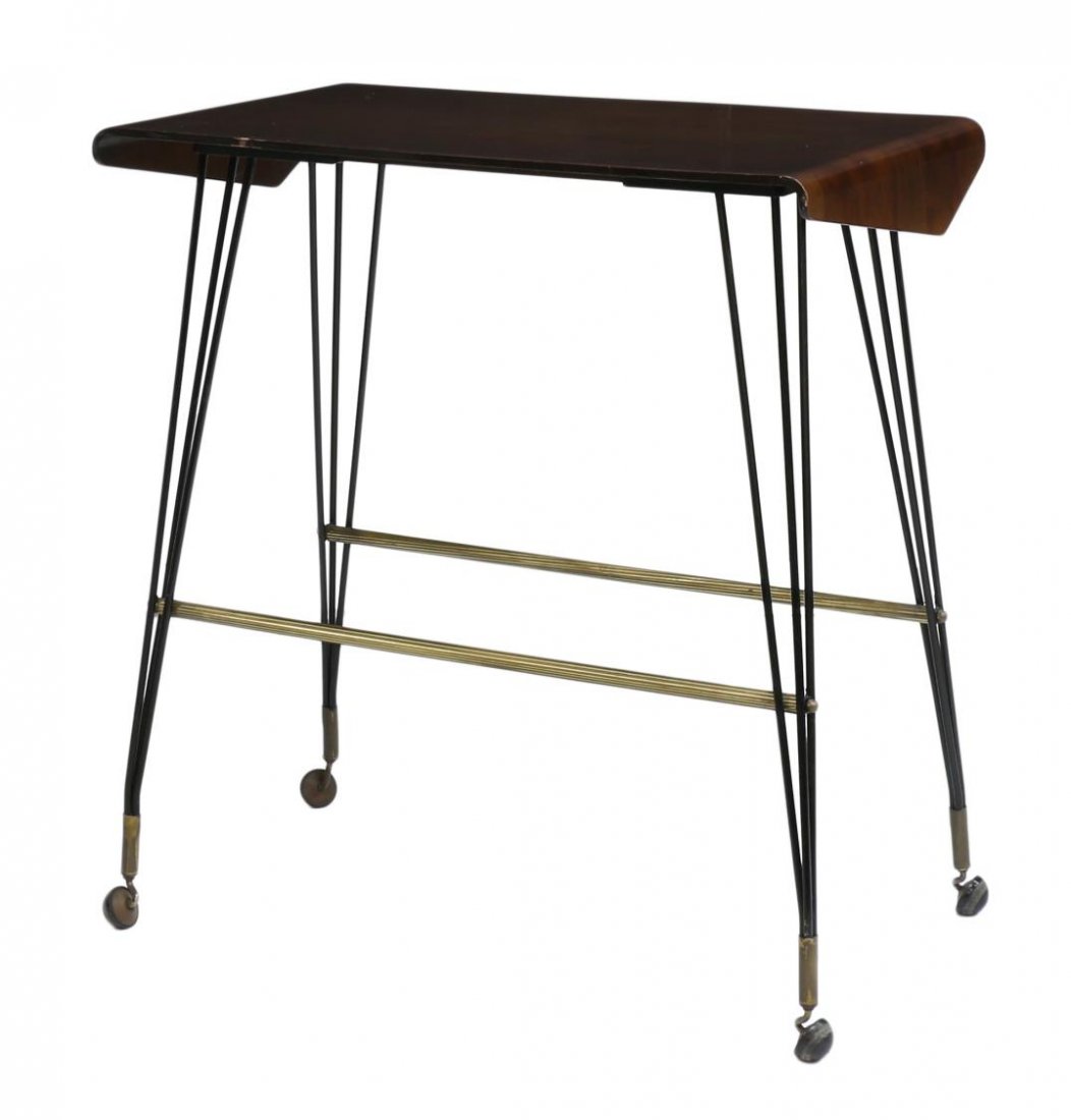 ITALIAN MID-CENTURY MODERN ROLLLING SERVICE CART: Italian mid-century modern service trolley, high gloss top having folded ends, rising on black iron legs, joined by gilt metal stretchers, the whole moving on castors, 32"h, 29.5"l, 16.5"d Start Price