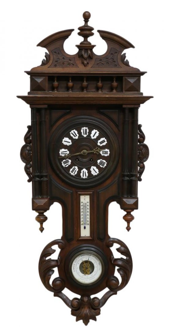 CONTINENTAL CARVED CLOCK / BAROMETER / THERMOMETER: Continental carved wood wall clock with barometer and thermometer, porcelain enamel Roman numerals, time and strike movement, double column decor with foliate relief and steeple finials, retaining key