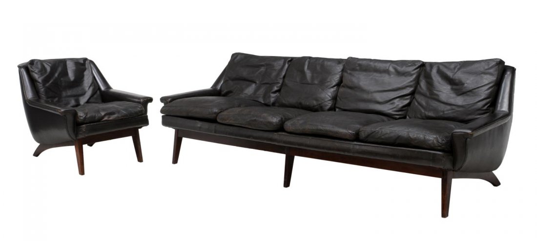 (2) DANISH MID-CENTURY MODERN LEATHER SOFA & CHAIR: (lot of 2) Danish mid-century modern sofa and chair, design by Illum Wikkelso (1919-1999), each finished in worn black leather, rising on tapered square angled legs: (1) sofa with four back and seat r