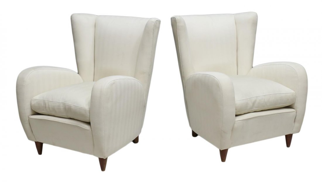 ITALIAN MID-CENTURY MODERN CHAIRS, PAOLO BUFFA: (pair) Italian mid-century modern arm chairs, c. 1950's, design by Paolo Buffa (Italian, 1903-1970), each having wing back in off white upholstery, down filled loose cushion seat, raised on short tape