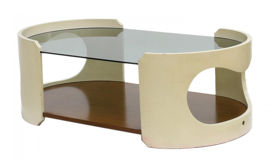 ITALIAN MID-CENTURY MODERN OVAL GLASS COFFEE TABLE: Italian mid-century modern coffee table, c. 1960, oval in form the curved ends in cream pain with open design, smokey glass top over natural wood lower shelf, some paint loss, approx 13"h, 38"w, 21"d 