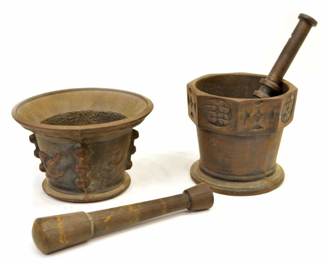 (4) CONTINENTAL CAST IRON MORTAR & PESTLE LOT: (lot of 4) Continental cast iron mortar and pestle, comprising: (1) mortar having geometric design to rim; (1) mortar having relief decor body; (2) pestles; approx largest mortar 5"h, 15lbs total Star