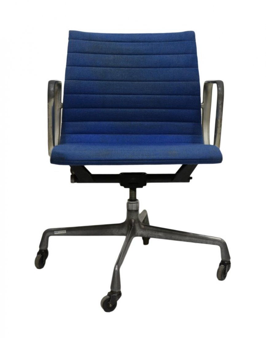 MID-CENTURY MODERN SOFT PAD CHAIR: Charles and Ray Eames soft pad aluminum framed tilt and swivel arm, for Herman Miller, c. 1969, each having blue upholstery, raised on a four part base, loss to covering finish over aluminum arms, 33"