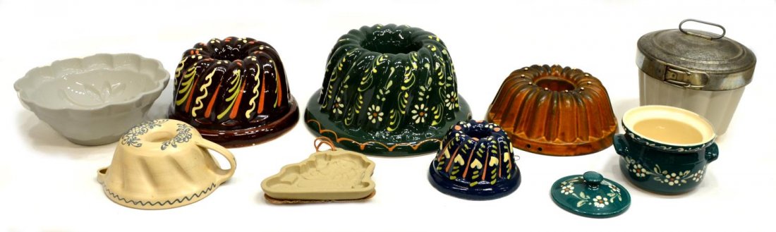 (9) ASSORTED GLAZED & ENAMELED CAKE & OTHER MOLDS: (lot of 9) Collection of assorted ceramic molds including bunt, cookie / ornament Sant and small covered pot, jello, etc., various decoration, glazes and size, largest in green with white enameled flo