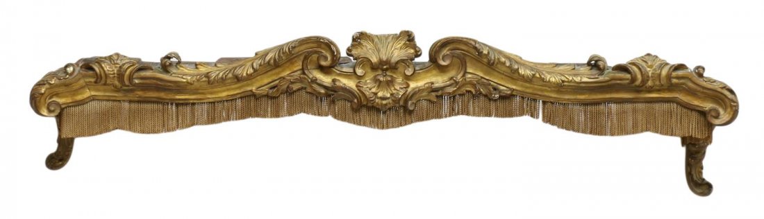 LOUIS XV STYLE CARVED GILTWOOD DRAPERY CORNICE: Louis XV style carved giltwood drapery cornice having fringed border, central shell crest with loss, approx 63.5"w (exterior measurement) Start Price: $150.00