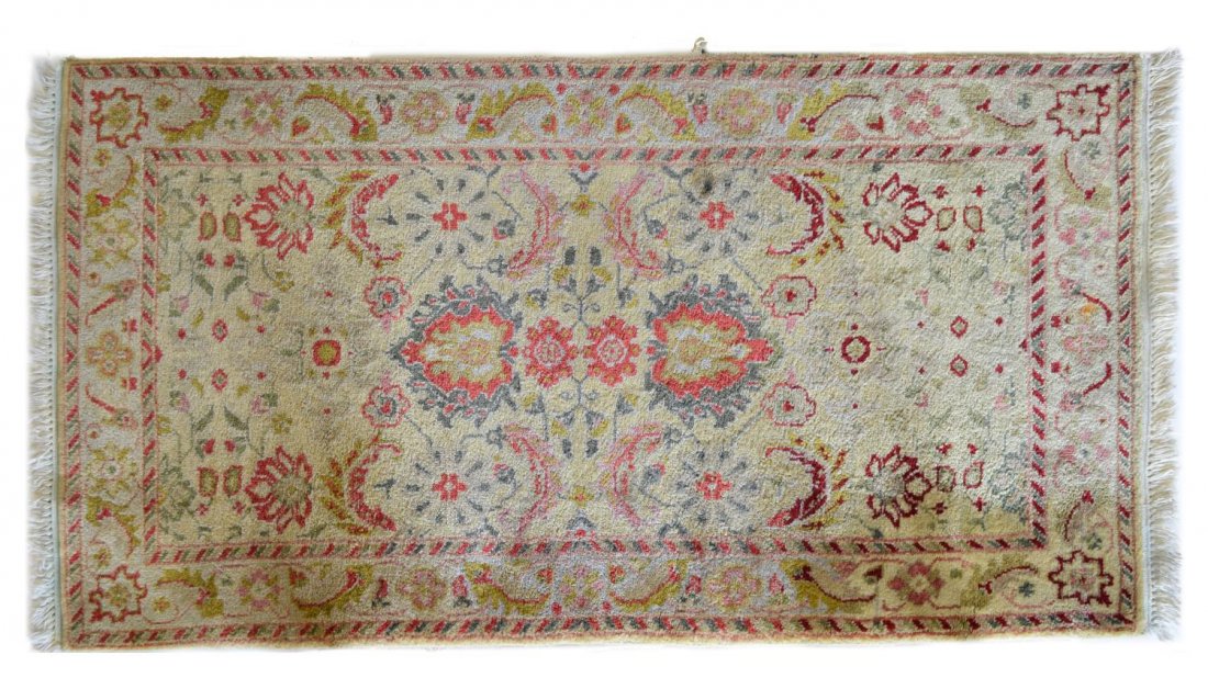 INDO AGRA HAND TIED WOOL RUG, 5'3" x 2'9": Indo Agra hand tied wool rug, loss to the side edge, approx 5'3"l, 2'9"w Start Price: $100.00