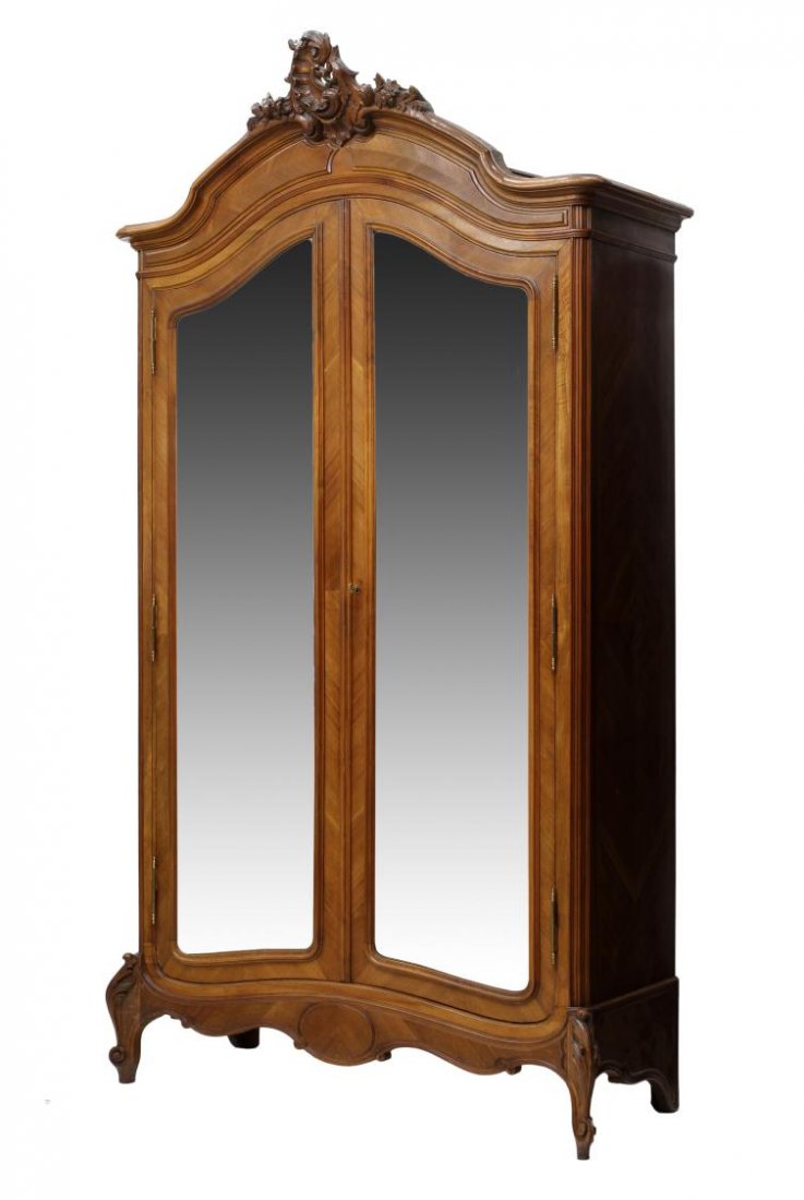 FRENCH LOUIS XV STYLE MIRRORED DOOR ARMOIRE: French Louis XV style armoire, early 20th c., ex. Hotel Aiglon, Menton, France, having a shaped cornice with centered rocaille crest over the single door faced with a large beveled mirror, rising on s
