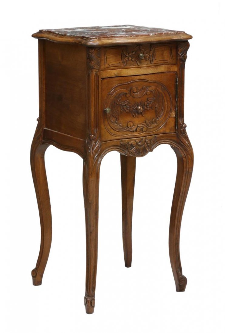 FRENCH CARVED MARBLE TOP SIDE CABINET: French Louis XV style side cabinet, Hotel Aiglon, Menton, France, 19th c., fitted marble top, over a floral carved drawer and cabinet door, opening to marble lined base, sides unfinished, all on slim 