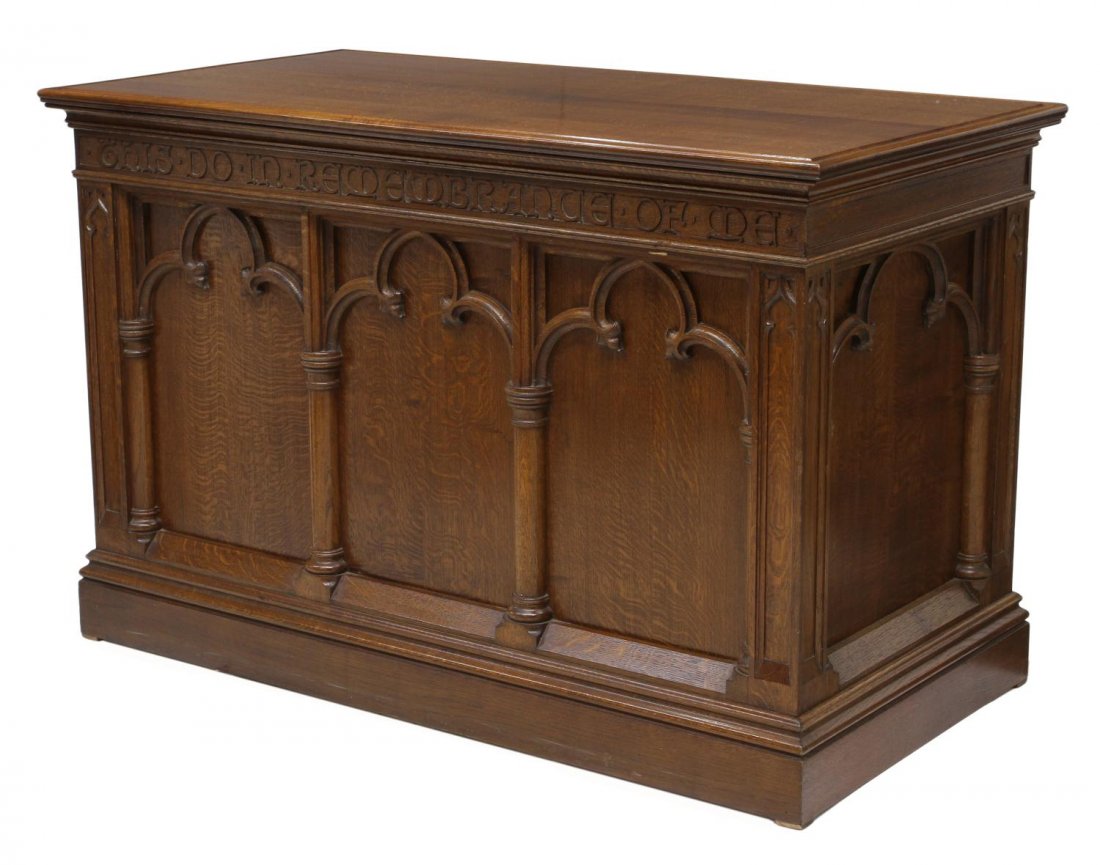 ENGLISH GOTHIC STYLE CHURCH COMMUNION TABLE: English oak church communion table with metal presentation plate dated 1937, a rectangular top over three paneled sides with gothic arches and columns, the front bearing the carved words "This Do In R