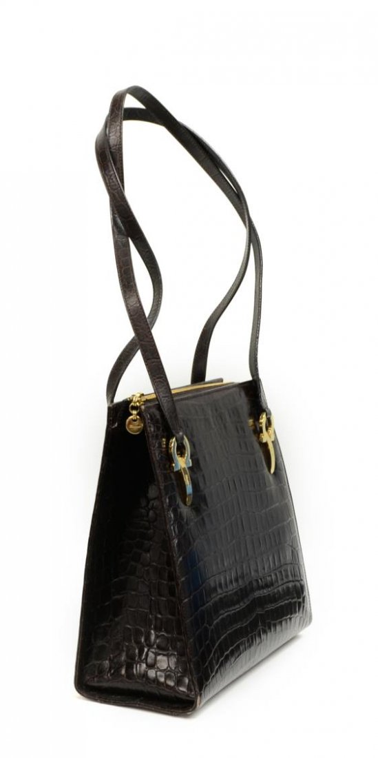 SALVATORE FERRAGAMO ANIMAL PRINT LEATHER PURSE: Salvatore Ferragamo shoulder bag in brown leather animal print with two matching hand straps, gold tone hardware, zipper top opens to black logo pattern cloth interior featuring single zipper pocket w