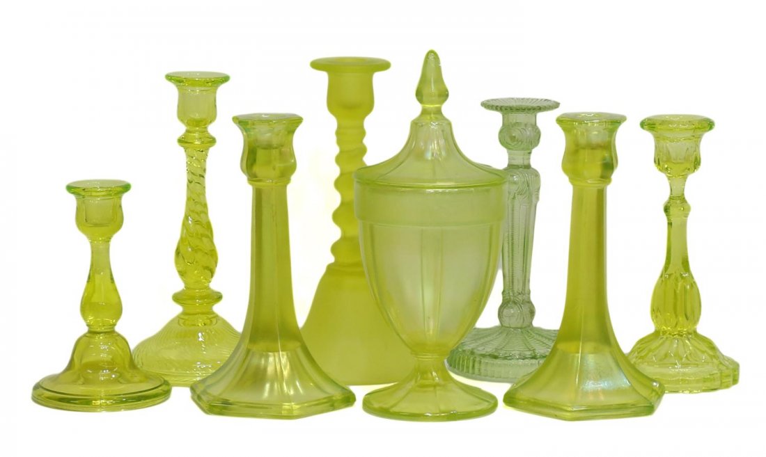 (8) COLLECTION VINTAGE VASELINE GLASS CANDLESTICKS: (lot of 8) Collection of Vintage vaseline art glass candlesticks and garniture set, including: (3 piece) covered jar and candlesticks garniture set, (5) candlesticks of various forms and sizes, all bu