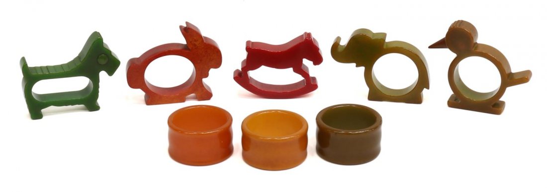 (8) VINTAGE BAKELITE ANIMAL FORM NAPKIN RINGS: (lot of 8) Collection of vintage bakelite napkin rings, comprising: (1) elephant; (1) bird; (1) rabbit; (1) rocking horse; (1) dog; (3) circular rings; largest approx 2.75'l, 2.25"w, .5lbs total Start