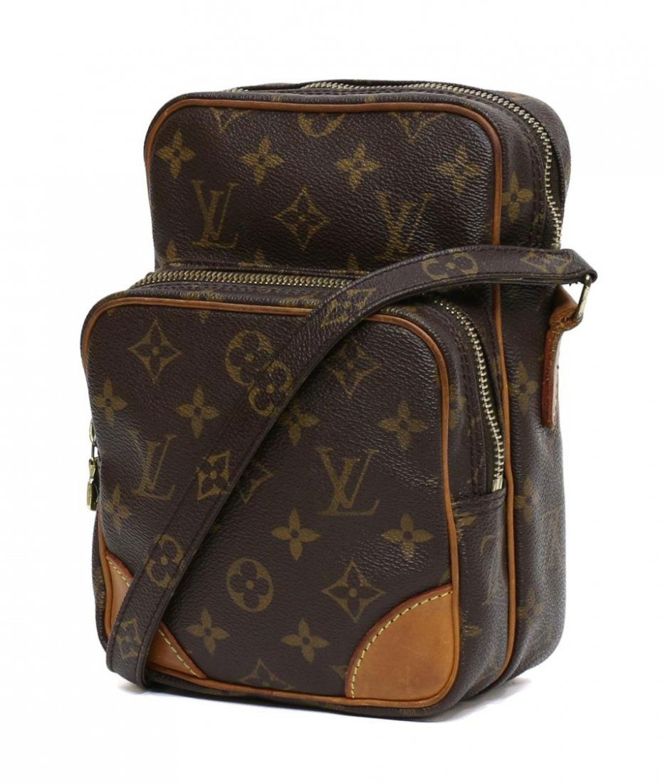 LOUIS VUITTON AMAZONE MONOGRAM CROSSBODY BAG: Louis Vuitton "Amazone" crossbody shoulder bag in monogram canvas, exterior zipper pocket, top unzips to brown leather interior featuring single slip pocket, leather accents and piping, adjustable sho
