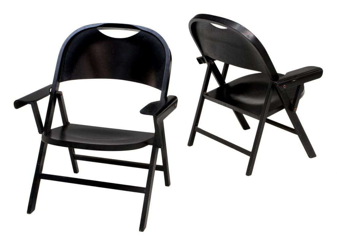 ITALIAN FOLDING CHAIRS, ACHILLE CASTIGLIONI: (pair) Italian black lacquer over wood folding chairs, Ginevra model, design by Achille Castiglioni (1918-2002), an arched back with open hand hold, folding arms, shaped seat, angled stretcher joined