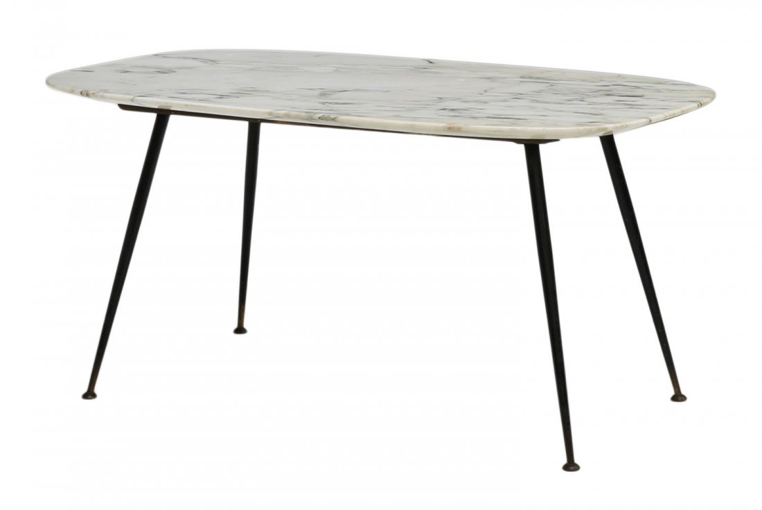 ITALIAN MID-CENTURY MODERN MARBLE COFFEE TABLE: Italian mid-century modern coffee table, c. 1960, an oval marble top rising on angled tapered black steel legs with circular cap feet, 18.25"h, 39.5"l, 20"d Start Price: $100.00