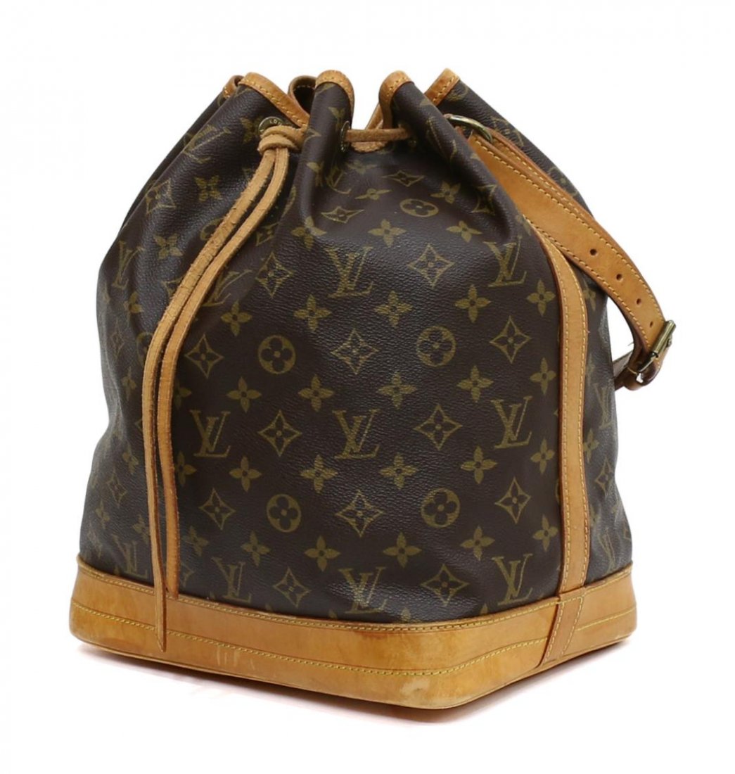 LOUIS VUITTON NOE MONOGRAM CANVAS SHOULDER BAG: Louis Vuitton 'Noe' monogram canvas shoulder bag, leather base, natural leather adjustable strap, some patination, wear and scuffs to leather, approx 13.5"h, 10.5"w, 7.75"d, 1lb Start Price: $200.00