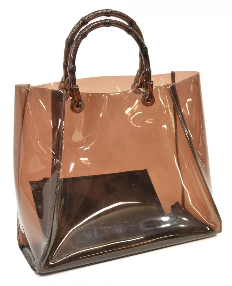 GUCCI BROWN PLASTIC BAMBOO HANDLED TOTE BAG: Gucci tote in brown plastic and bamboo shaped handles, detachable pouch to interior, bag: approx 11.5"h, 13.5"w, 5"d, 1.5lbs Start Price: $100.00