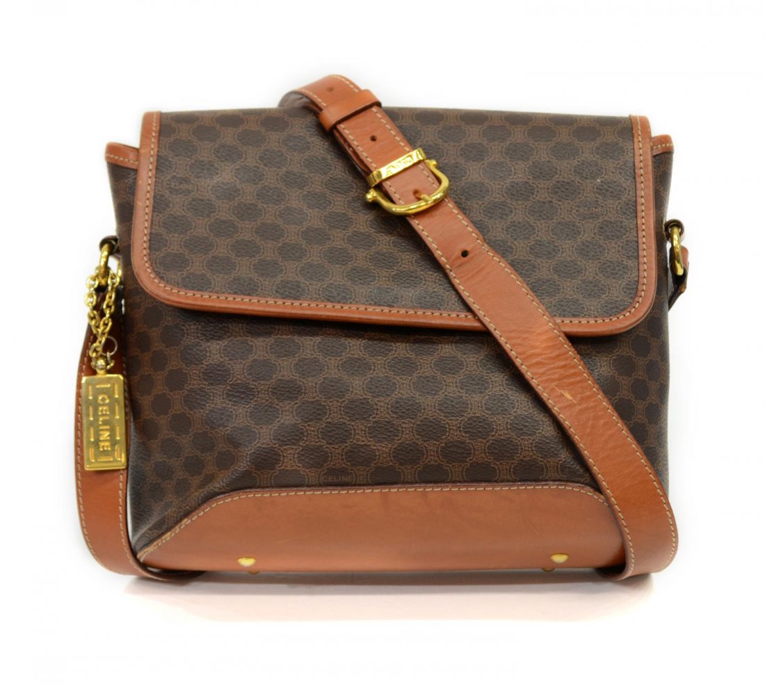 CELINE BROWN MONOGRAMMED CANVAS SHOULDER BAG: Celine brown monogrammed coated canvas shoulder bag with strap, gold tone hardware, exterior slip pocket, light brown interior featuring Riri zipper pocket, minor wear on bottom edge, bag: 8.25"h, 9.5