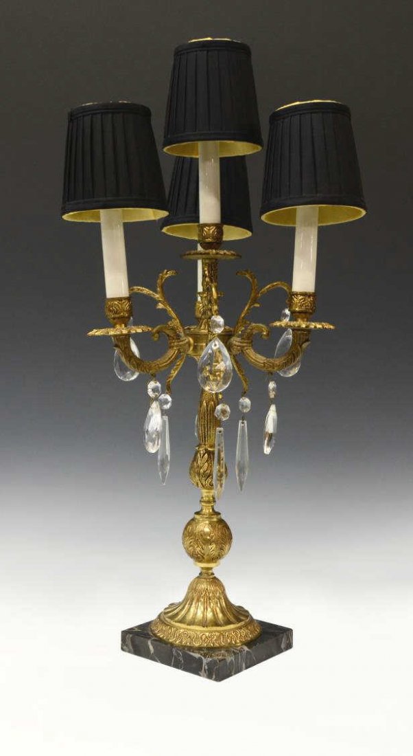 BRASS & CRYSTAL TABLE LAMP: Brass and crystal desk lamp, 20th c., having four lights with black shades, all on a square marble base, minor fracture on one light shaft (white), 24.5"h, 9.5"w, 9.5"d, 7.75lbs Start Price: $80.00