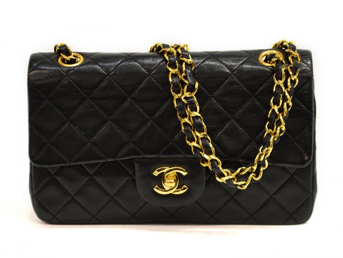 CHANEL TIMELESS CLASSIC DOUBLE FLAP & CHAIN PURSE: Chanel black leather classic double flap bag, chain strap, CC turnlock, red leather interior with three compartments and second flap with button closure, one compartment with two open cell pockets, ac