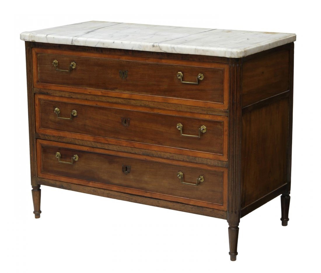 FRENCH LOUIS XVI STYLE MARBLE TOP COMMODE: French Louis XVI style commode, early 19th c., having a marble top with rounded protruding front corners, three drawers, rising on tapered turned legs, 35.25"h, 44.5"w, 21.75"d Start Price: $400.00