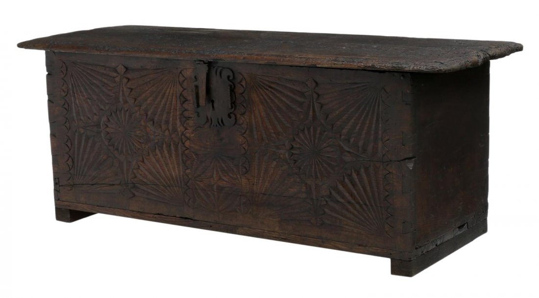 FRENCH CARVED OAK COFFER, 18TH C.: French oak trunk or coffer, 18th c., having a strap hinged lift top, the front with extensive geometric carving and dovetailed corners, rising on block feet, wood loss, restorations, 23"h, 57.5"w, 22"