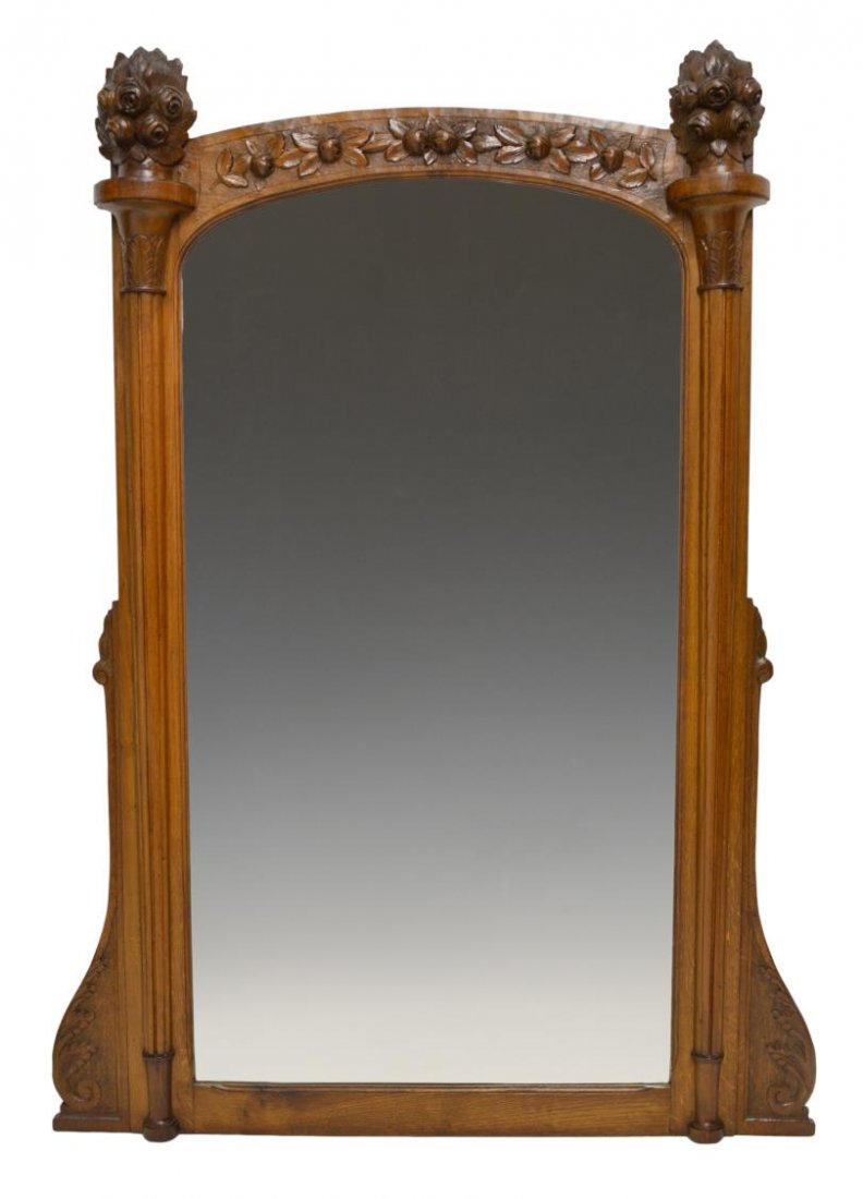 FRENCH LOUIS XV STYLE FLORAL CARVED WALL MIRROR: French relief carved wood wall mirror, flowering urn form finials surmount an arched crest carved in relief with floral buds, pilasters to either side of the central flat mirror plate, approx 56"h, 43