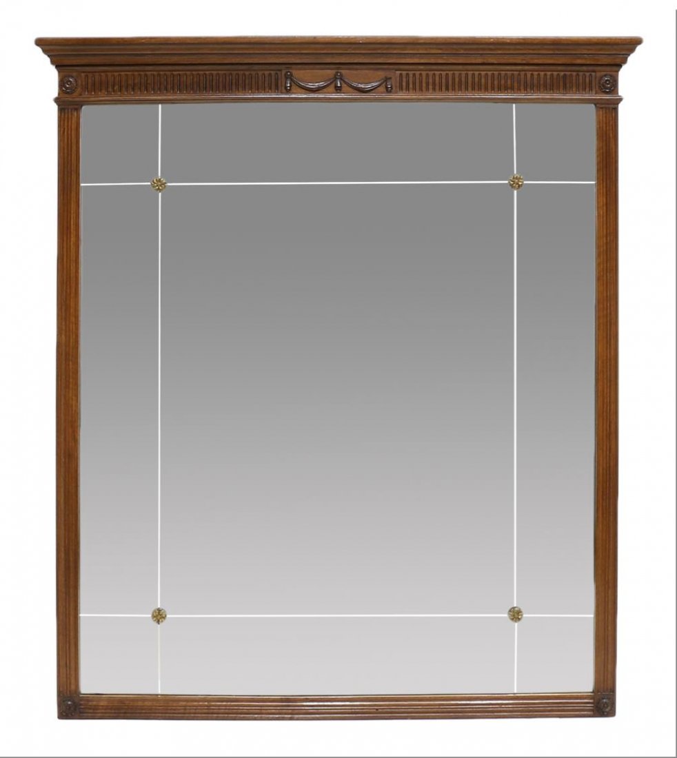 LOUIS XVI STYLE CARVED WALL MIRROR: Louis XVI style wall mirror, with a flared cornice over a gadroon and boss carved frieze centering a series of swag, over the square frame, gilt metal bosses at the corner of each glazed pane, minor l