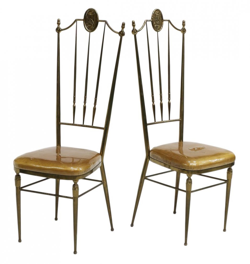 (2) FRENCH HIGHBACK GILT BRASS HALL CHAIRS: (pair) French highback gilt brass hall chairs, c. 1950, an oval pictorial medallion cresting the spindled back, over gold upholstered seats encased in plastic, tapering cylindrical legs joined by stre