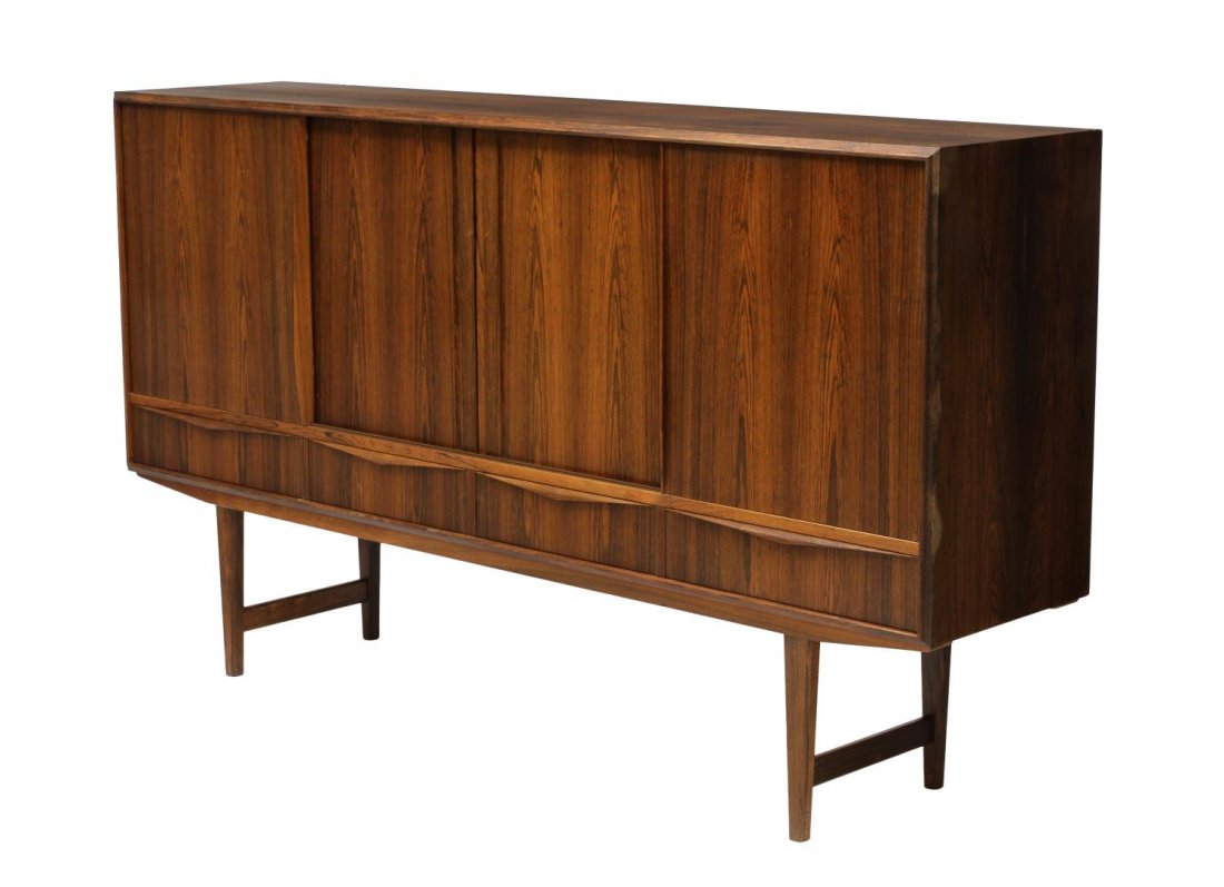 DANISH MID-CENTURY MODERN ROSEWOOD SIDEBOARD: Danish mid-century modern rosewood sideboard, c. 1950's / 1960's, sliding doors on the cabinet base opening to shelves and two drawers to one side, approx 31"h, 77.25"w, 17"d Start Price: 400.00