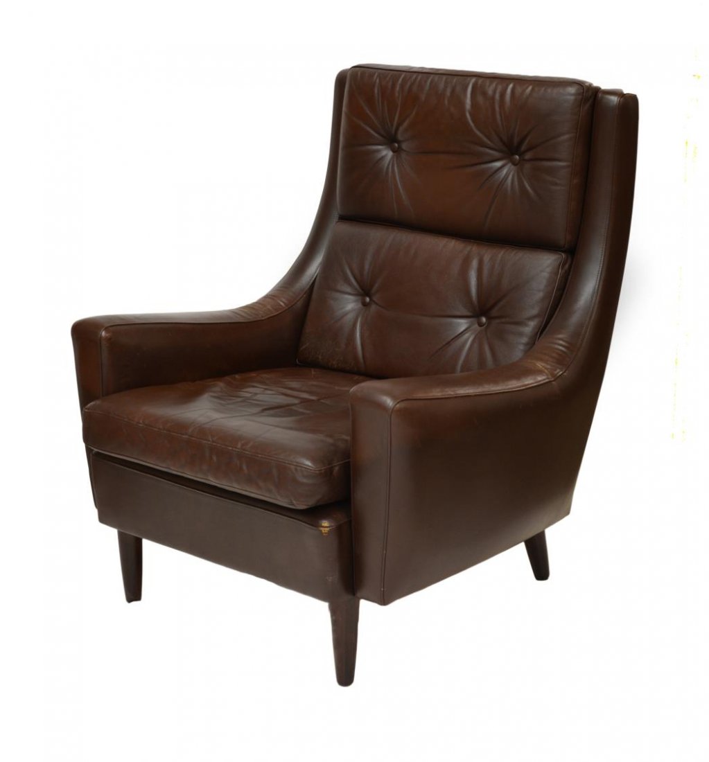 DANISH MODERN LEATHER UPHOLSTERED ARM CHAIR: Danish modern brown leather upholstered arm chair, late 1960's, having removable back and seat cushions, rising on tapered turned legs, 36"h, 31"w, 29"d Start Price: 150.00